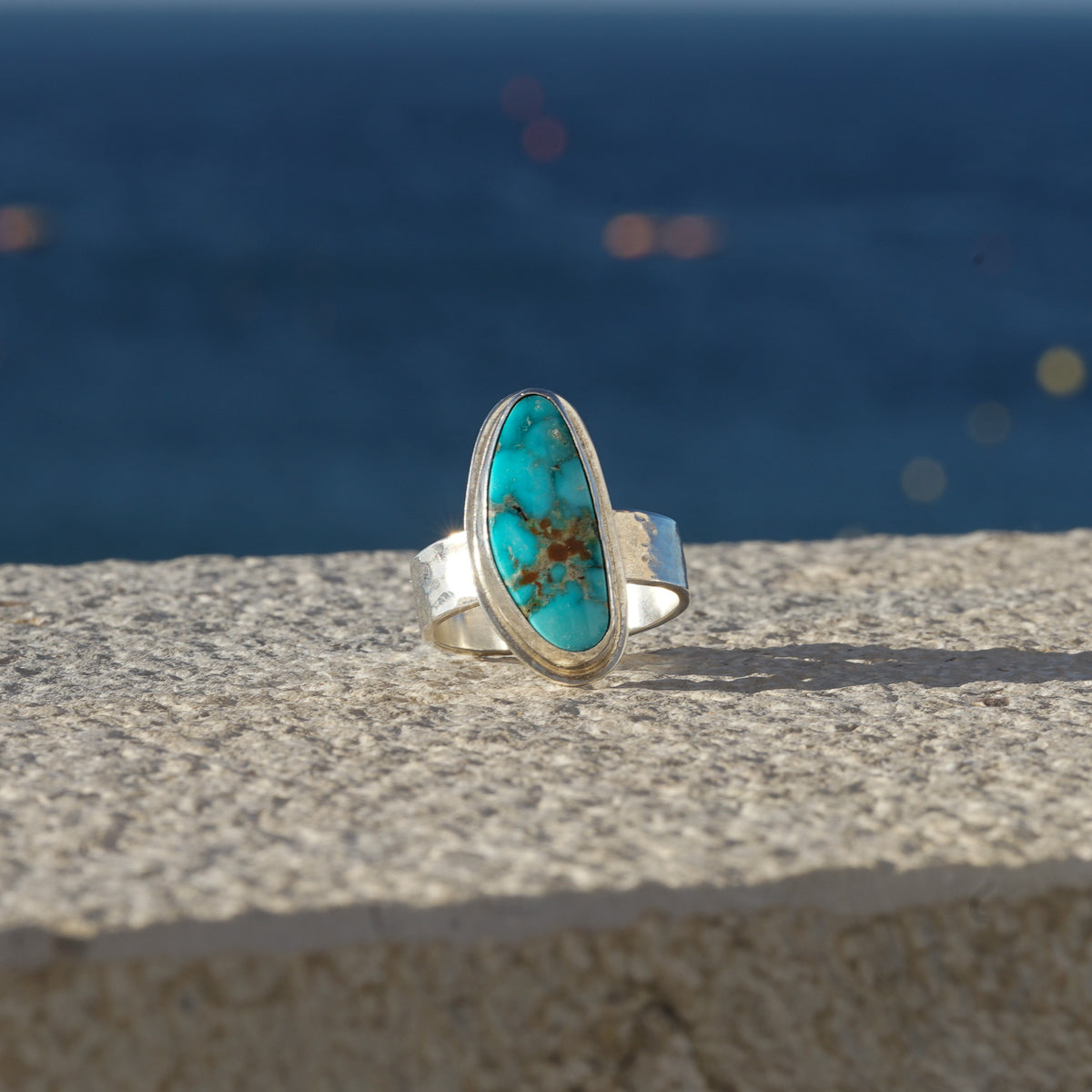 Kingman Turquoise Long Triangle on a Hammered Silver Ring Band